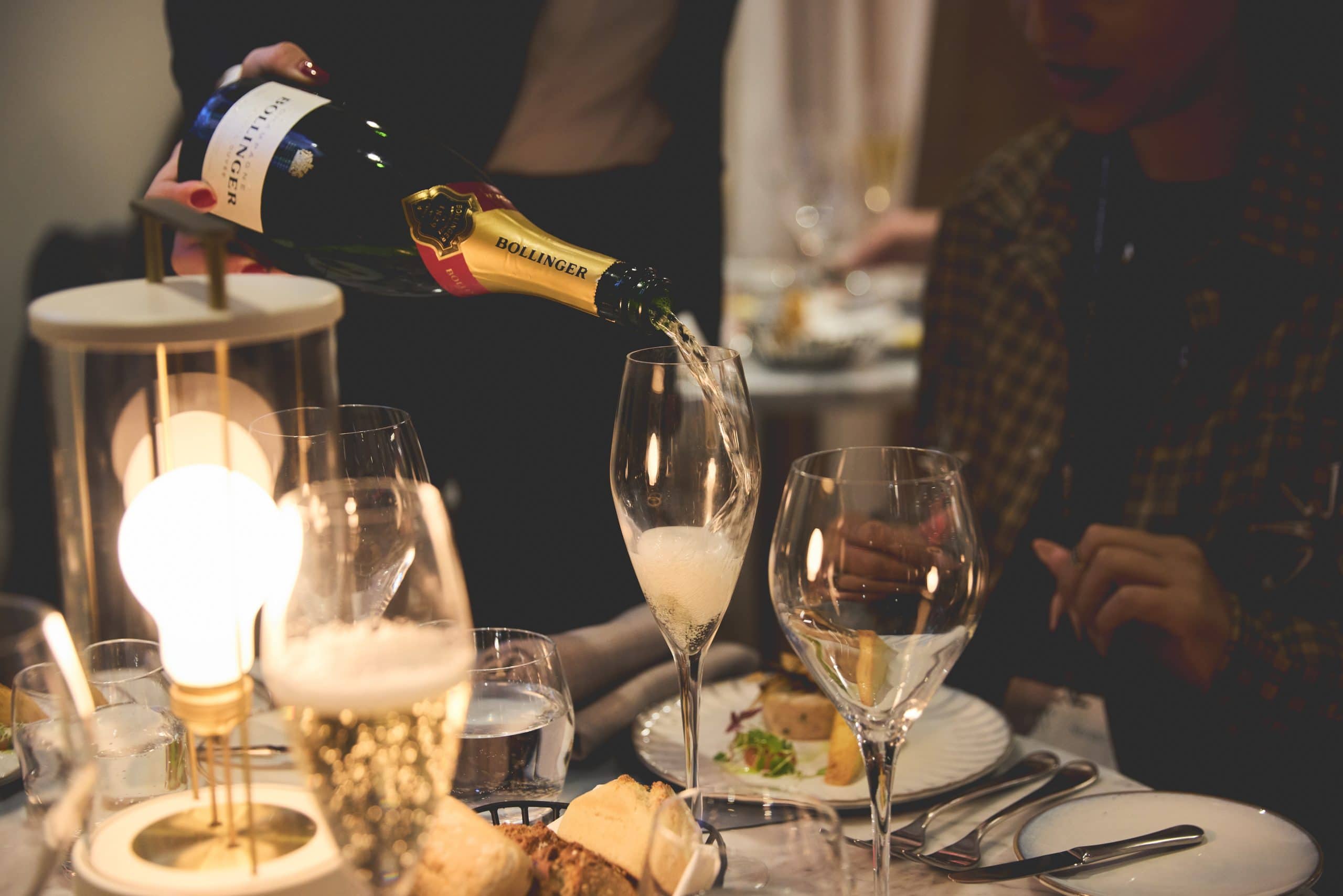 Pouring champagne in hospo